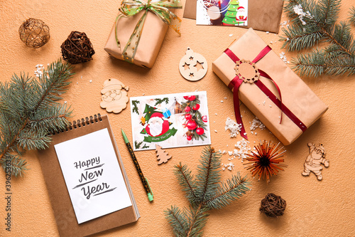 Fototapeta Naklejka Na Ścianę i Meble -  Beautiful greeting cards for New Year celebration and gifts on color background