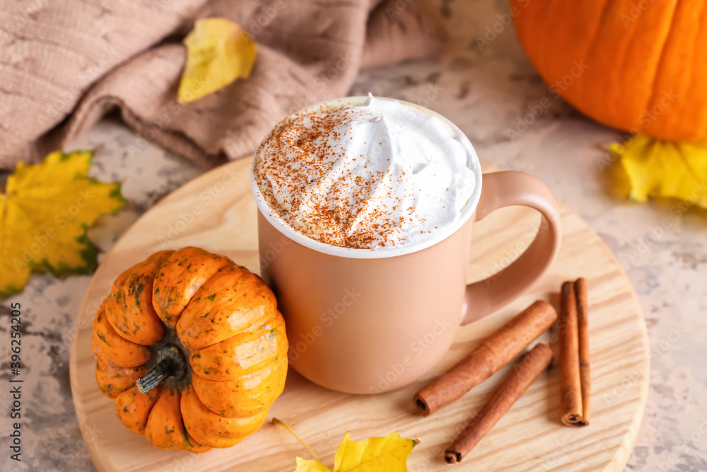 Cup of pumpkin cappuccino on table Cup of pumpkin cappuccino on table