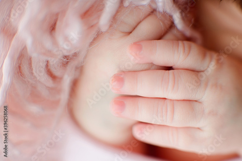 Caucasian Newborn baby hand closeup macro detail shot. child portrait, health skin, tenderness, maternity and babyhood concept - Image. Soft selective focus