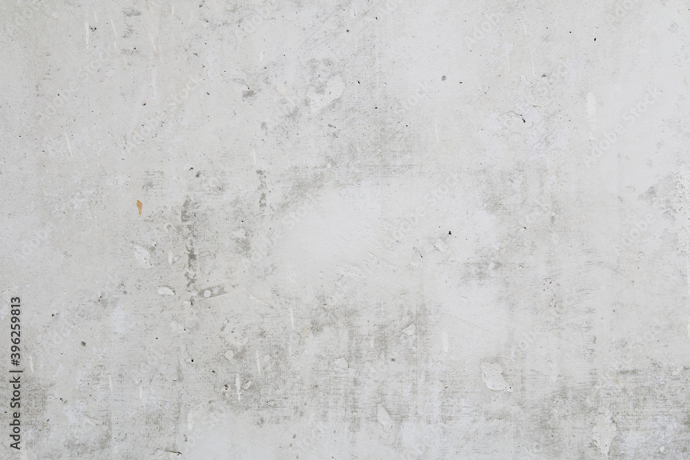 Fototapeta premium Gray concrete wall peeled of wallpaper. Concrete background.
