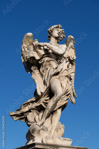 Angel with the Superscription statue on Ponte Sant Angelo bridge in Rome  Italy. Marble sculpture from 17th century  design of Gian Lorenzo Bernini