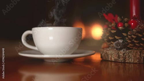 Wallpaper Mural Closeup of a hot mug of coffee chocolate or tea by the fireplace at Christmas. Relaxing at home during winter holidays. Torontodigital.ca