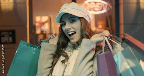 Woman enjoying shopping and carrying bags