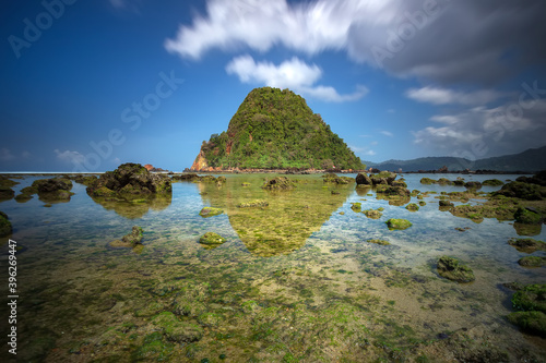 View of Red island beach in Banyuwangi in Indonesia. Java popular travel destination. Summer holiday background.