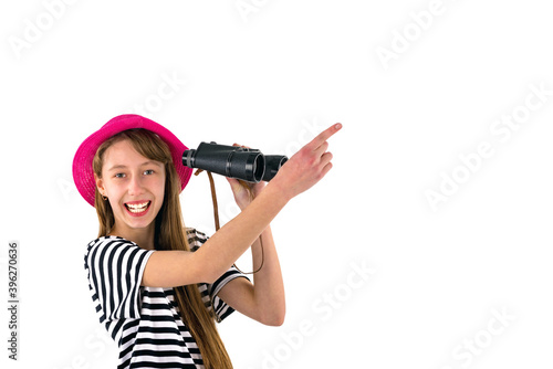 teenage girl shows at copy space. globe with binoculars isolated on white background. © ARVD73