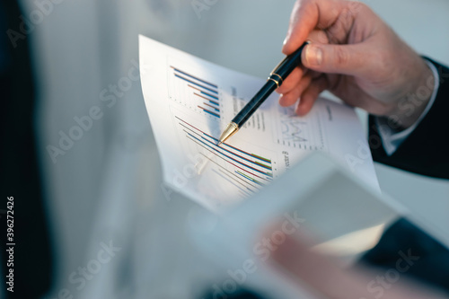 close up. businessman analyzing financial chart. business concept