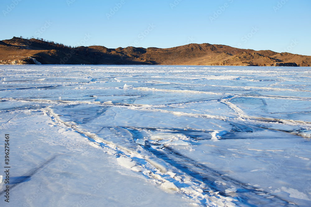 Beautiful landscape of frozen Lake Baikal. Small Sea Strait in winter sunny frosty winter day.