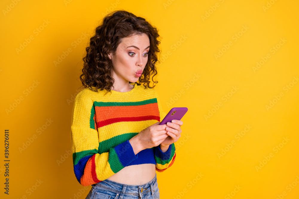Photo of charming nice brunette hair young lady blow kiss to telephone wear short pullover isolated on bright yellow background Photo of charming nice brunette hair young lady blow kiss to telephone wear short pullover isolated on bright yellow background