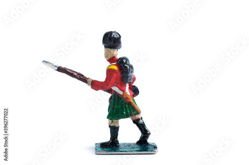 Photo of tin soldier's figurine on the white background