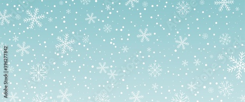 Horisontal blue background with snowfall. Snowy winter Christmas and New Year texture decoration. White falling snowflakes