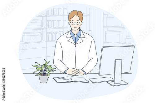 Doctor, medicine, healthcare concept. Young smiling man doctor in white uniform cartoon character sitting in medical clinic office near laptop and notebook. Medicare, therapist, pharmacist