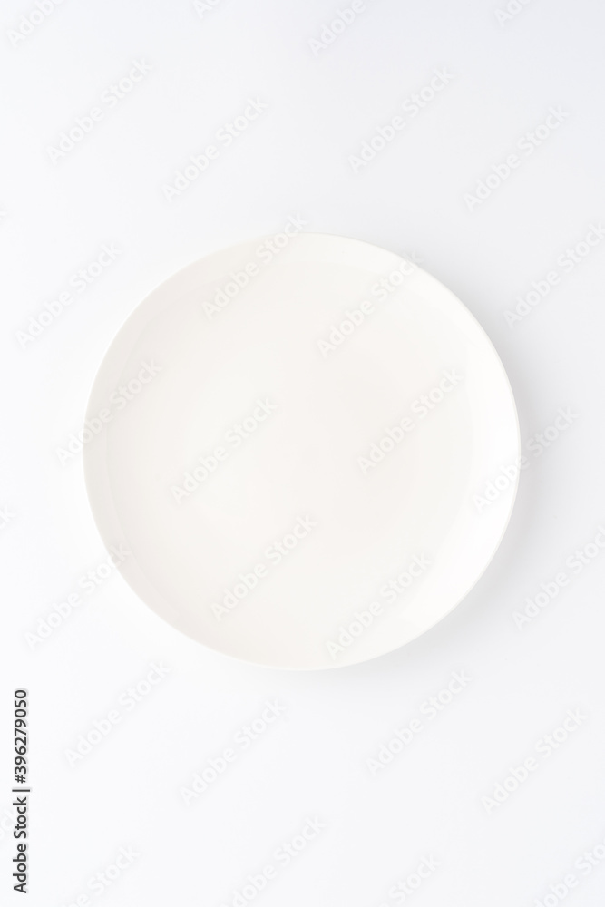 Overhead shot of blank white dish isolated on white background. Close up Overhead shot of blank white dish isolated on white background. Close up