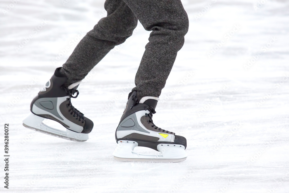 people ice skating on an ice rink. hobbies and leisure. winter sports people ice skating on an ice rink. hobbies and leisure. winter sports