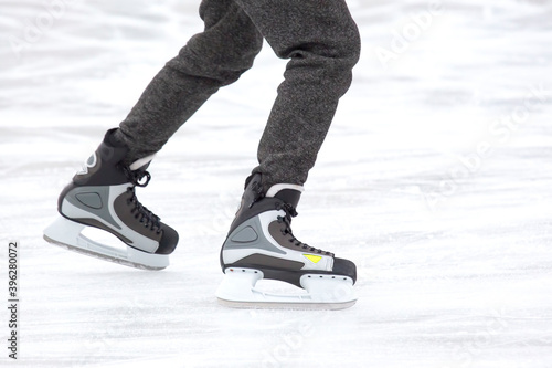 people ice skating on an ice rink. hobbies and leisure. winter sports