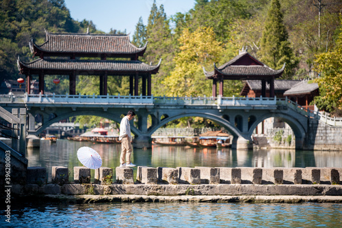 Street view local visitor and tourist atFenghuang old town Phoenix ancient town or Fenghuang County is a county of Hunan Province, China