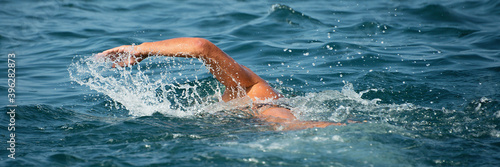 Swimmer floating crawl into the blue sea © pavel1964