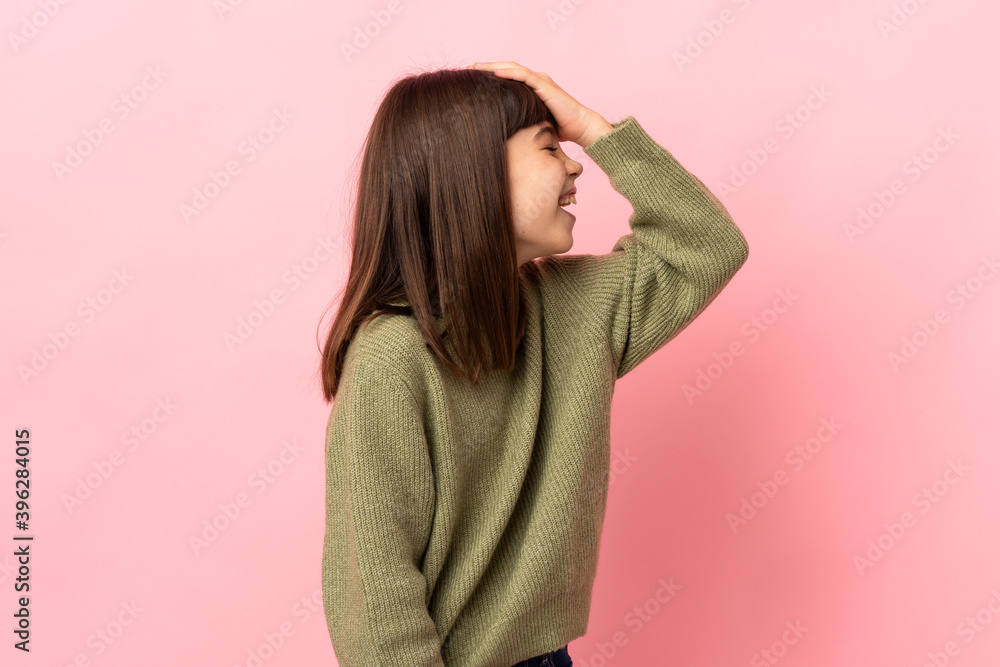 Little girl isolated on pink background has realized something and intending the solution Little girl isolated on pink background has realized something and intending the solution
