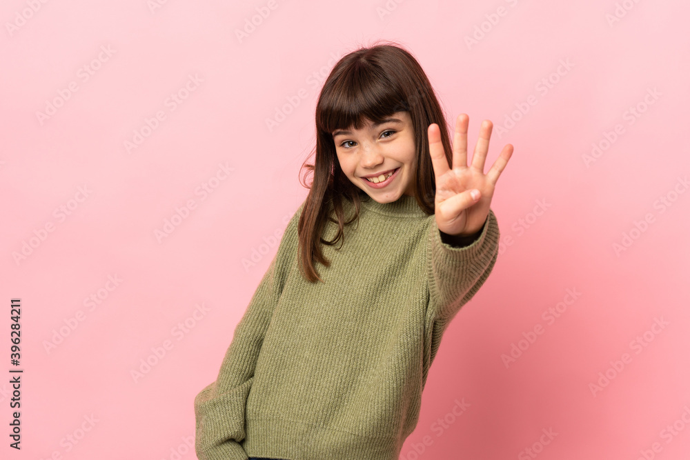 Little girl isolated on pink background happy and counting four with fingers Little girl isolated on pink background happy and counting four with fingers