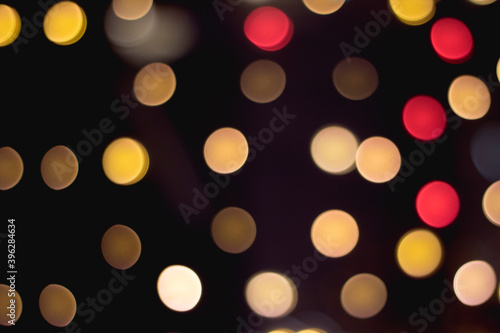 Multicolored bokeh circles on a dark background