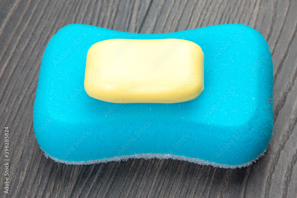 bath sponge and soap on wooden background bath sponge and soap on wooden background