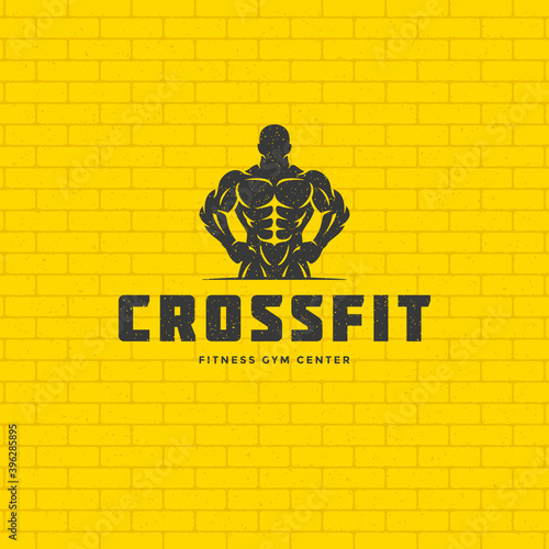 Bodybuilder man logo or badge vector illustration male bodybuilding symbol silhouette.