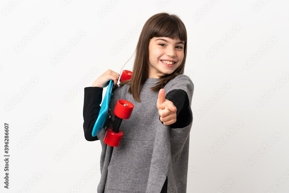 Little girl isolated on white background with a skate and pointing to the front Little girl isolated on white background with a skate and pointing to the front