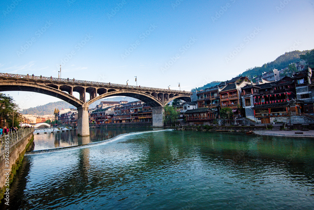 Naklejka premium Scenery of old houses in Fenghuang City, Hunan Province, China. The ancient city of Fenghuang is regarded by UNESCO as a World Heritage Site.