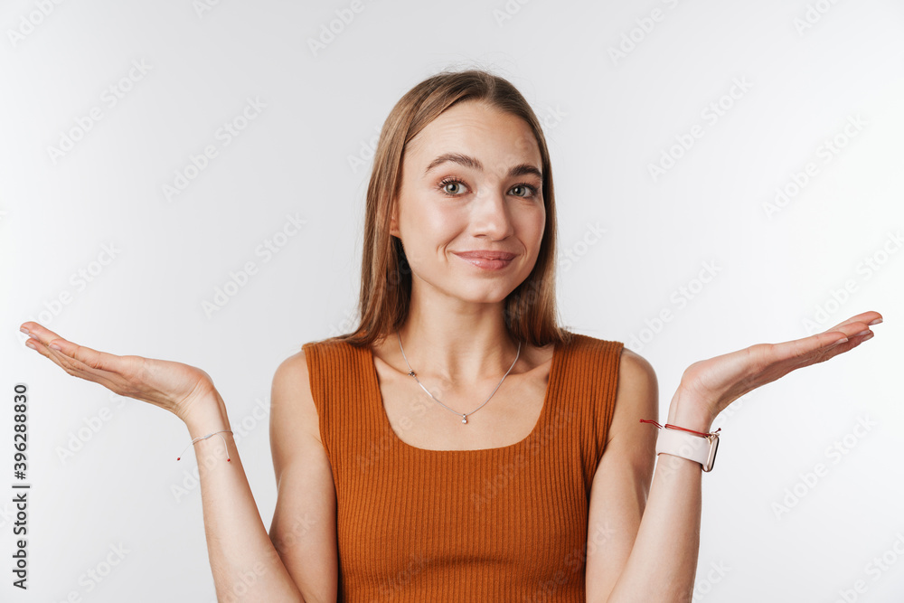 Pleased beautiful woman smiling and holding copyspace Pleased beautiful woman smiling and holding copyspace