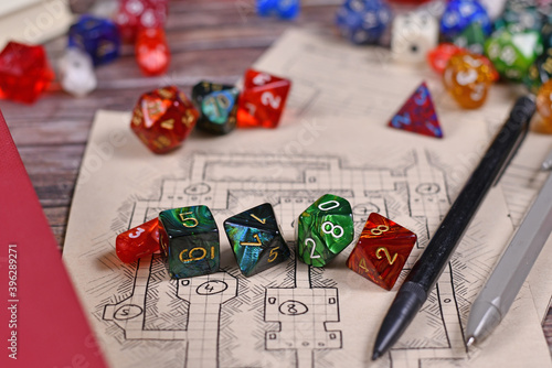 Obraz na plátne Colorful tabletop role playing RPG game dices on hand drawn dungeon map