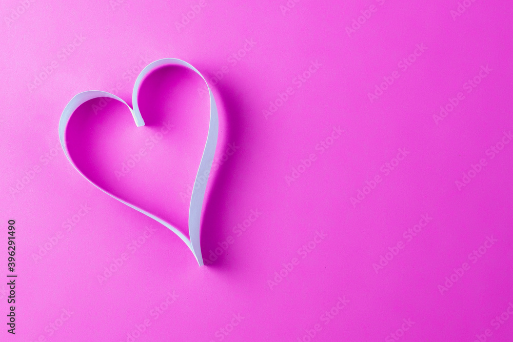 paper ribbon heart on pink background paper ribbon heart on pink background