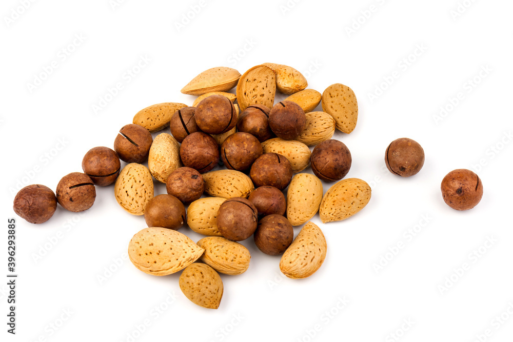 Assorted Nuts. Background of nuts - macadamia, almonds, isolated on white background Assorted Nuts. Background of nuts - macadamia, almonds, isolated on white background