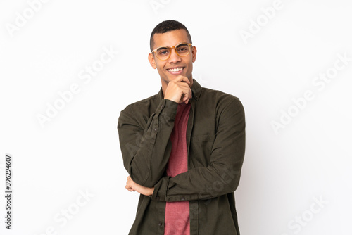 Young African American man over isolated white background with glasses and smiling