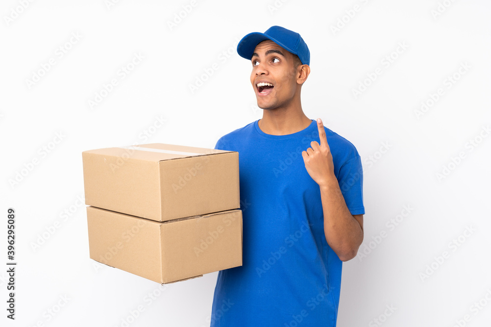 Delivery man over isolated white background intending to realizes the solution while lifting a finger up Delivery man over isolated white background intending to realizes the solution while lifting a finger up