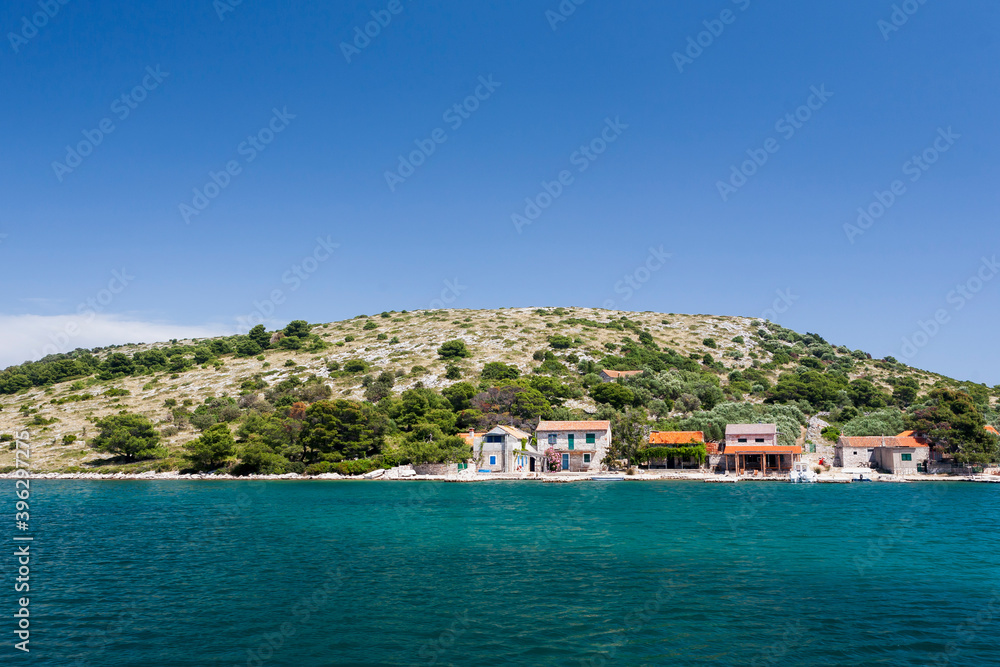 Tiny hamlet inhabited only in Summer on the bay on the island of Lavsa in the Kornati National Park, Croatia