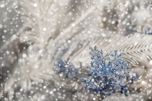 Snowy abstract nature in soft colors. Blurry winter gray-white snowy floral background with snowflakes and sparkling blur. 