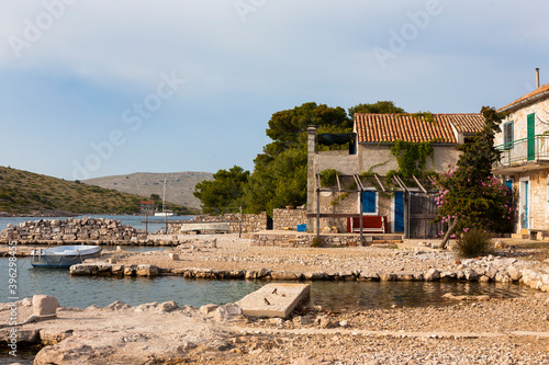 Tiny hamlet inhabited only in Summer on the bay on the island of Lavsa in the Kornati National Park, Croatia photo