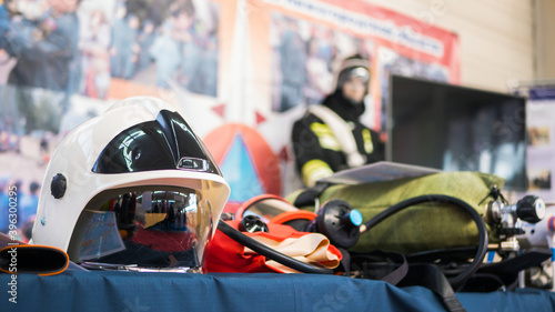 Special equipment of rescue worker - mask, helmet, oxygen cylinder at emergency services show