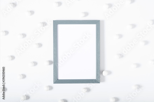 Christmas, winter composition. Xmas decorations, photo frame on white background. Christmas, New Year, winter concept. Flat lay, top view, copy space © prime1001