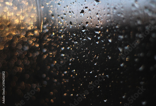 raindrops on the window in the evening sun  like Christmas lights