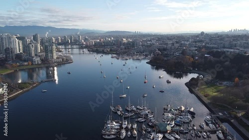 Fly over False creek in Vanvouver with yacths on a sunny autumn morning photo