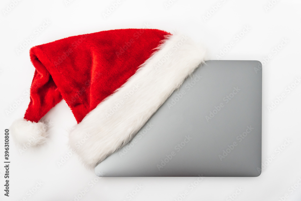 Laptop with Santa Claus hat for Christmas Laptop with Santa Claus hat for Christmas