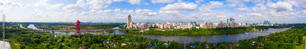 Panoramic view of Moscow on a sunny day, Russia. Picturesque region in the north-west of Moscow city. Zhivopisny bridge across the Moscow river.
