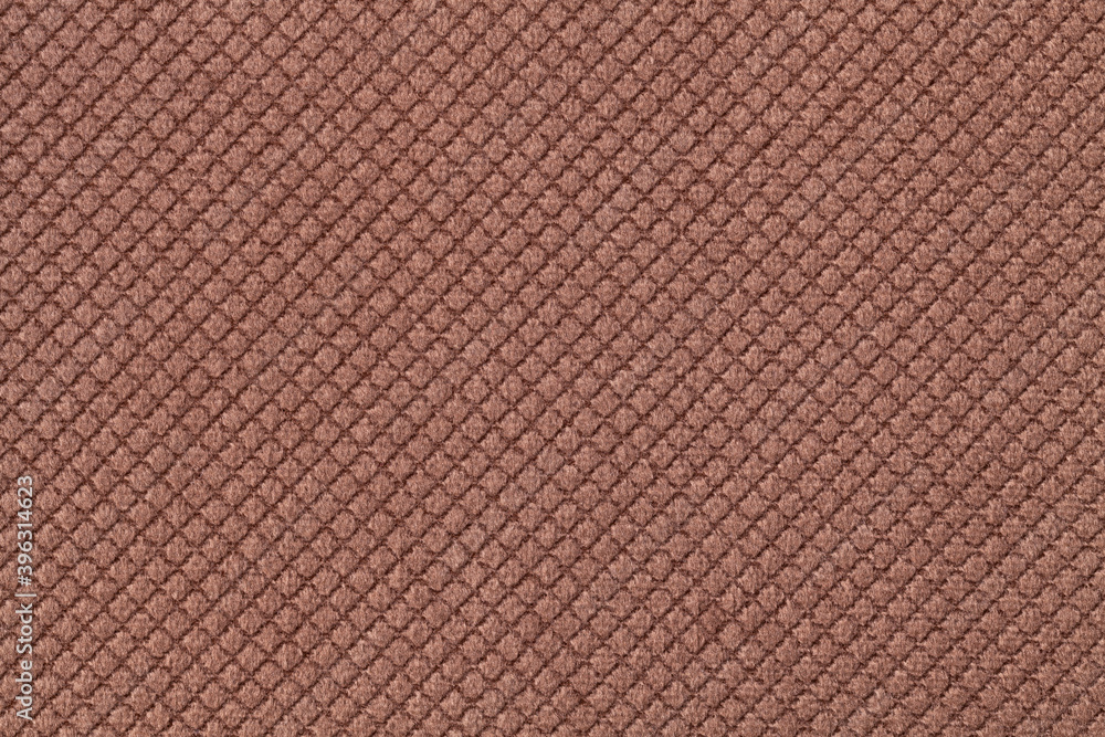 Texture of dark brown fluffy fabric background with rhomboid pattern, macro. Texture of dark brown fluffy fabric background with rhomboid pattern, macro.