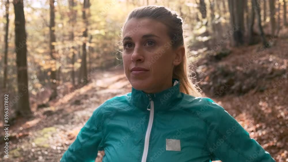 Woman closing zipper of sportive jacket Woman closing zipper of sportive jacket