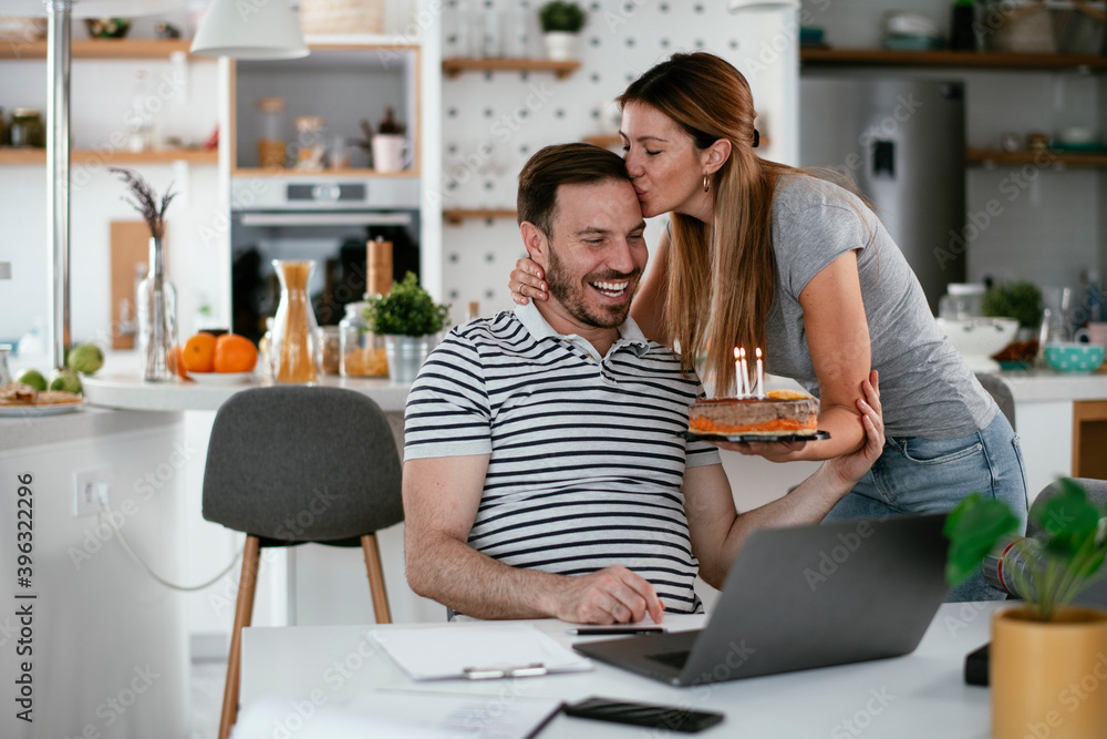 Husband's birthday. Wife surprise her husband with birthday cake. Husband's birthday. Wife surprise her husband with birthday cake.