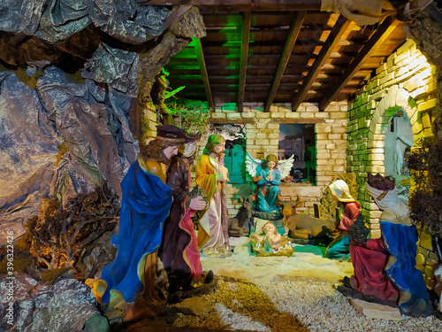 Details of Nativity scene of Christ with colored figures at christmas time