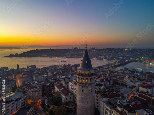 Aerial Galata Tower at Sunset. Galata Bridge and Golden Horn of Istanbul with beautiful colors at Sunset. 