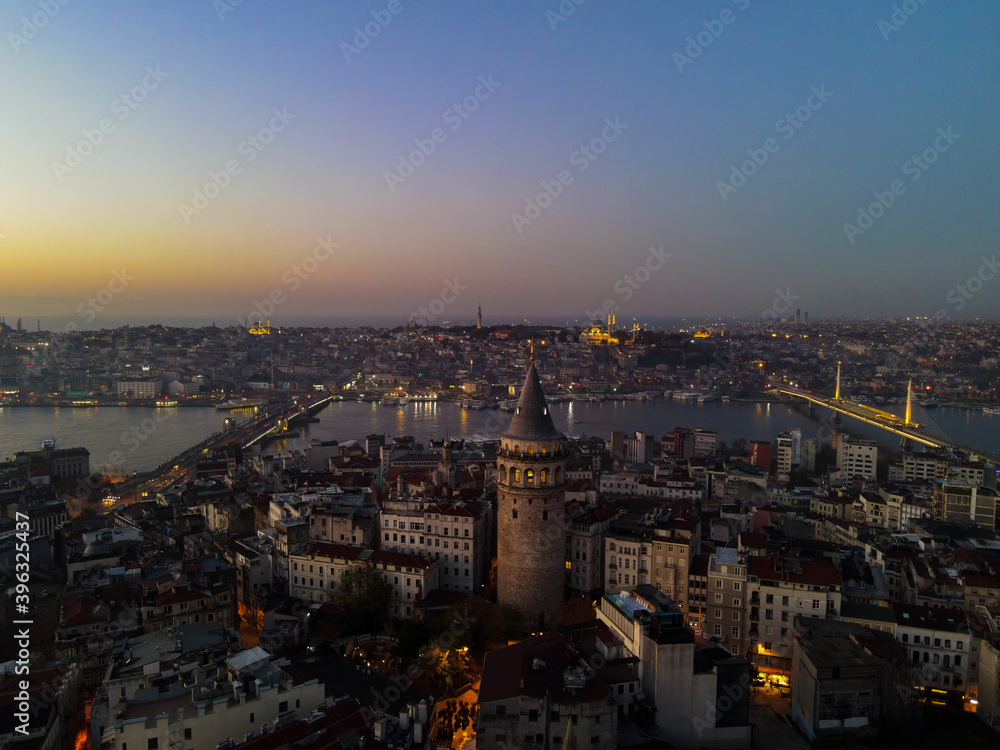 Aerial Galata Tower at Sunset. 
Galata Bridge and Golden Horn of Istanbul with beautiful colors at Sunset. 