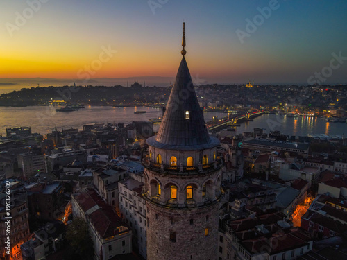 Aerial Galata Tower at Sunset. 
Galata Bridge and Golden Horn of Istanbul with beautiful colors at Sunset. 