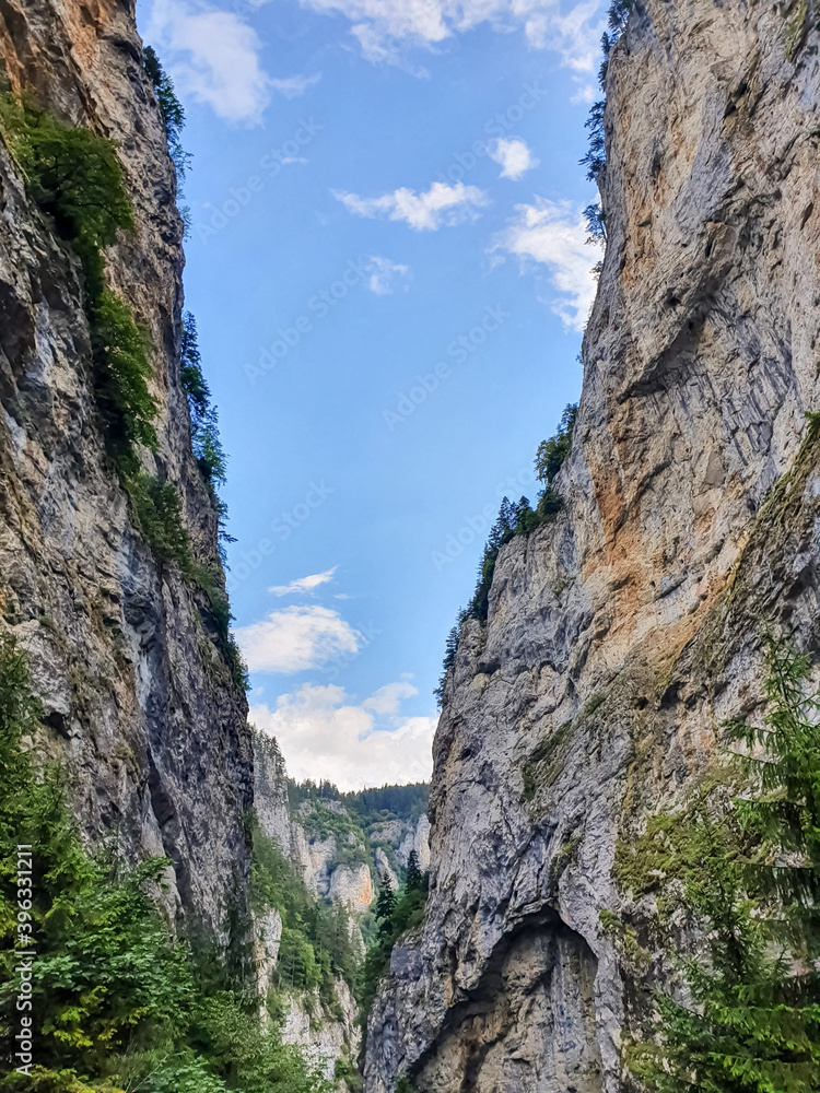 Curvy road between steep rocks of Trigrad gorge in the Western Rhodopes, Bulgaria.